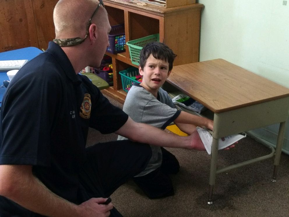 PHOTO: Lakeland Fire Department rescue crews worked patiently and kept Gio Aponte calm as they worked to free his finger from the desk, June 30, 2016.