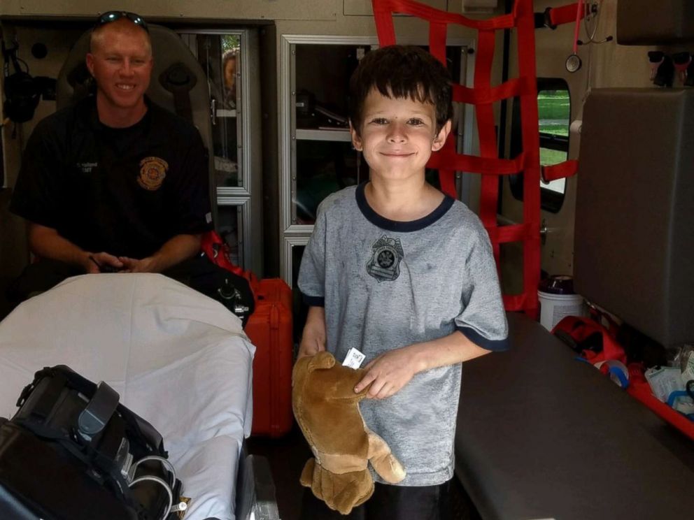 PHOTO: Gio Aponte stands inside a firetruck after crews safely freed his finger from a desk in Lakeland, Fla., June 30, 2016.