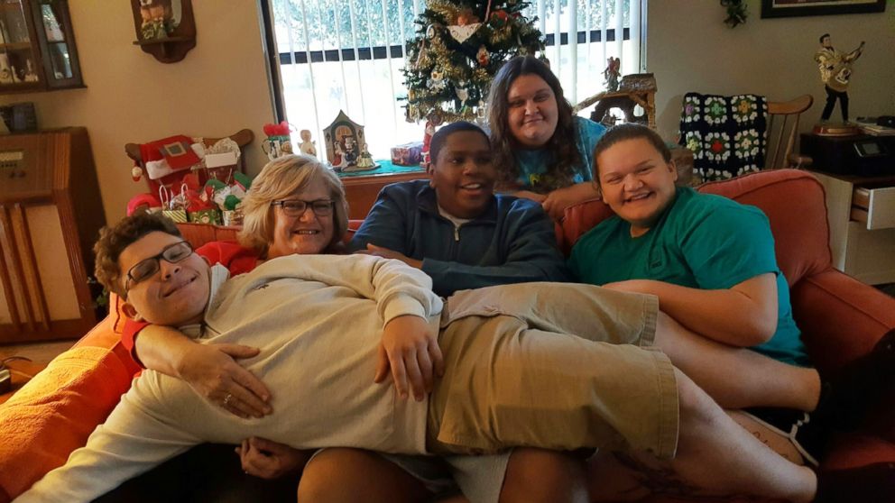 PHOTO: Davion Only-Going, 19, center, who captured the world's heart in 2013 when he publicly pleaded for a family, is celebrating his second adoption anniversary with the Goings of Florida.