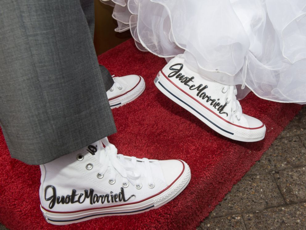 PHOTO: Krista Owens and Danielle Reno are photographed in matching sneakers during their wedding on the top of the Empire State Building in New York, Feb. 14, 2017.