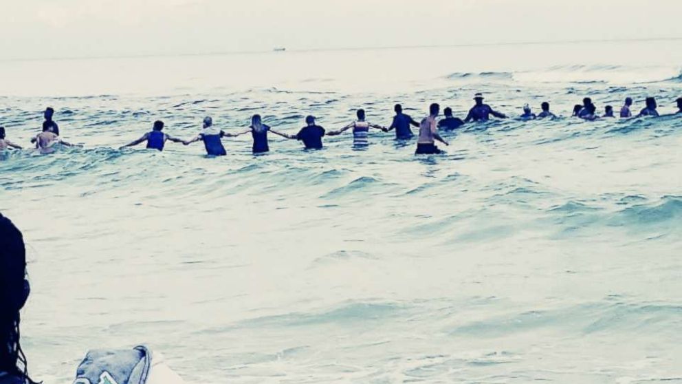 PHOTO: A group of strangers linked arms and waded into the ocean to rescue a group of swimmers stranded off the coast of Panama City Beach, Fla., July 8, 2017.