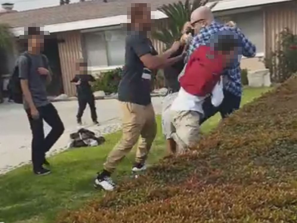 PHOTO: Video shows two teens who witnessed the struggle between a 13-year-old and off-duty LAPD officer in Anaheim, California trying to intervene in order to free their friend.