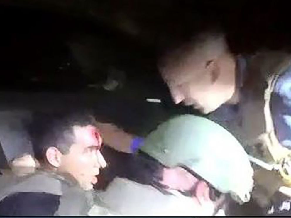 PHOTO: An image released by the Orlando Police shows a SWAT officer receiving treatment after he was struck in the head by gunfire while responding to the shooting at the Pulse Nightclub on June 12, 2016 in Orlando, Fla.