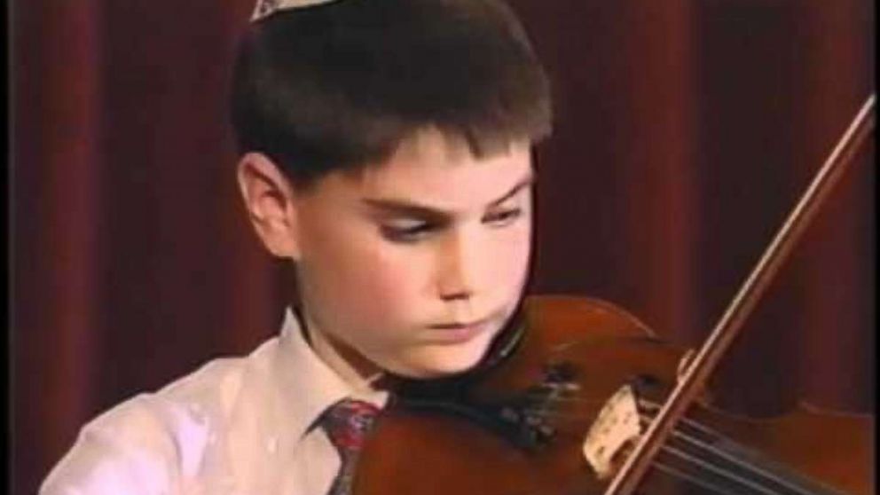 Ben Shapiro is seen here playing the violin as a child in this undated family photo. 