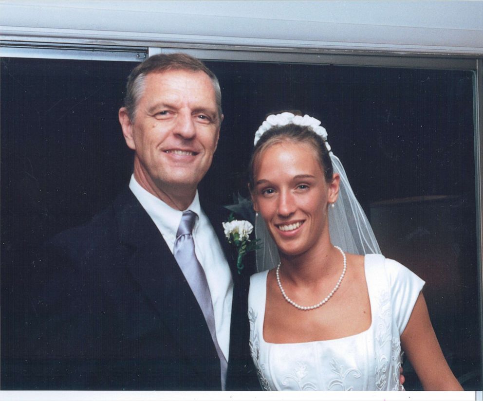 Janet Abaroa is seen here with her father on her wedding day in August 2000. 