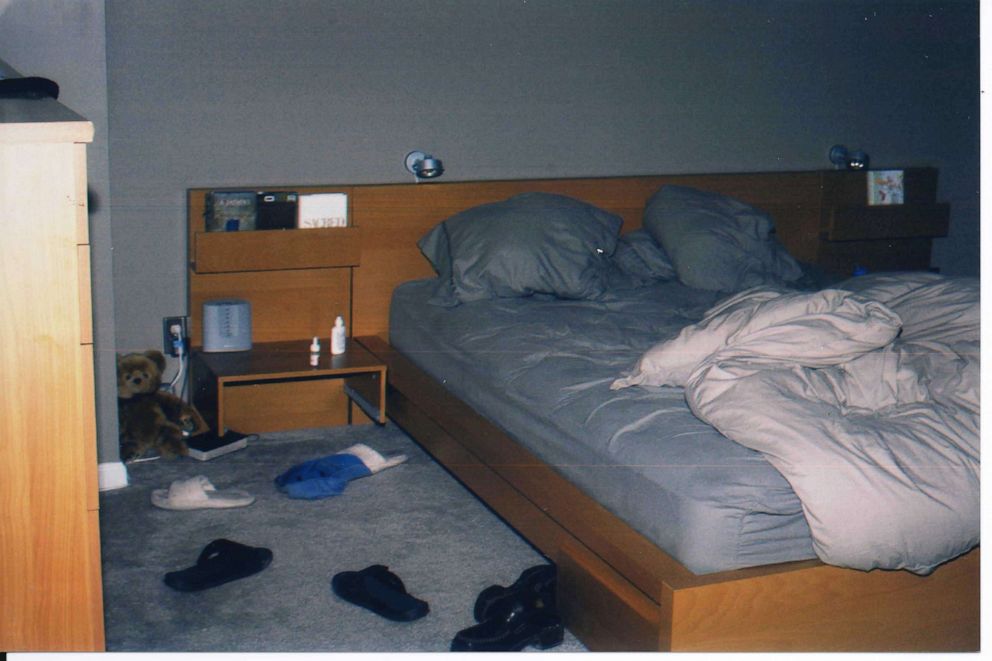 Police photo shows the bedroom inside the Abaroa home. 