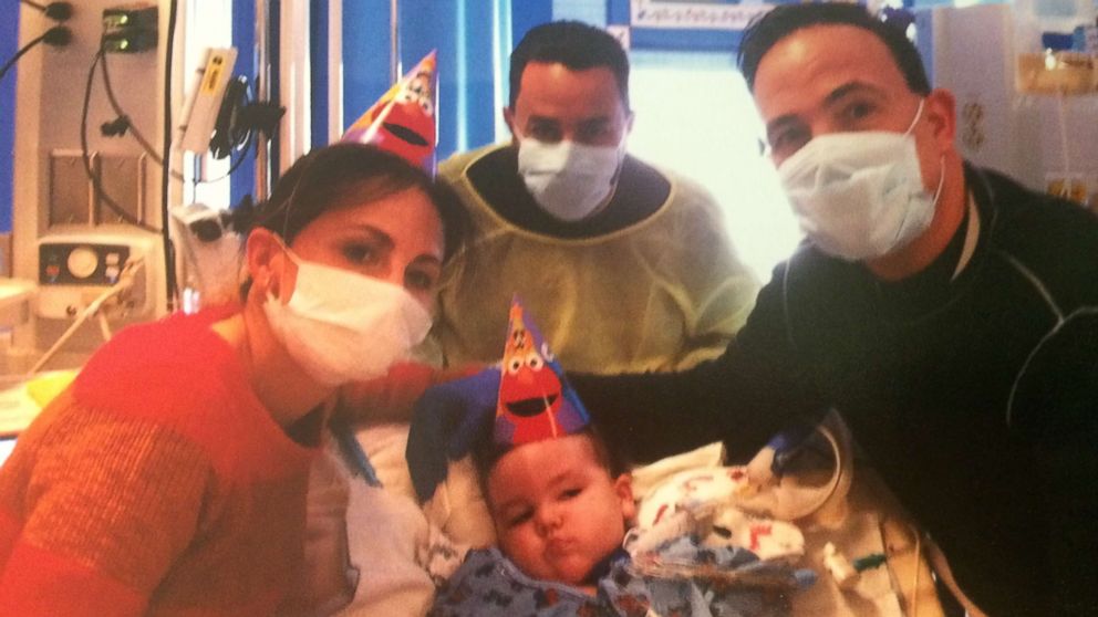 Art Estopinan, Jr., is seen here with family on his second birthday. 