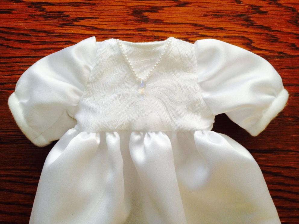 Members of the volunteer group Caring Hands for Angels use donated wedding dresses to sew burial gowns for babies in Rochester, N.Y.