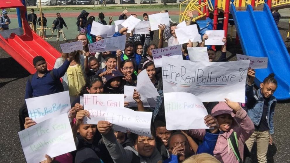 Students in Ms. Pingel's fifth grade class at Lakeland School in Baltimore show off their signs that read, "#TheRealBaltimore" in an image shared by Megan Pingel on April 29, 2015.