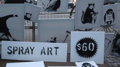 PHOTO: Banksy set up a one-time, pop-up stall on Fifth Ave. near Central Park where he sold his spray art for $60 apiece, Oct. 13, 2013.