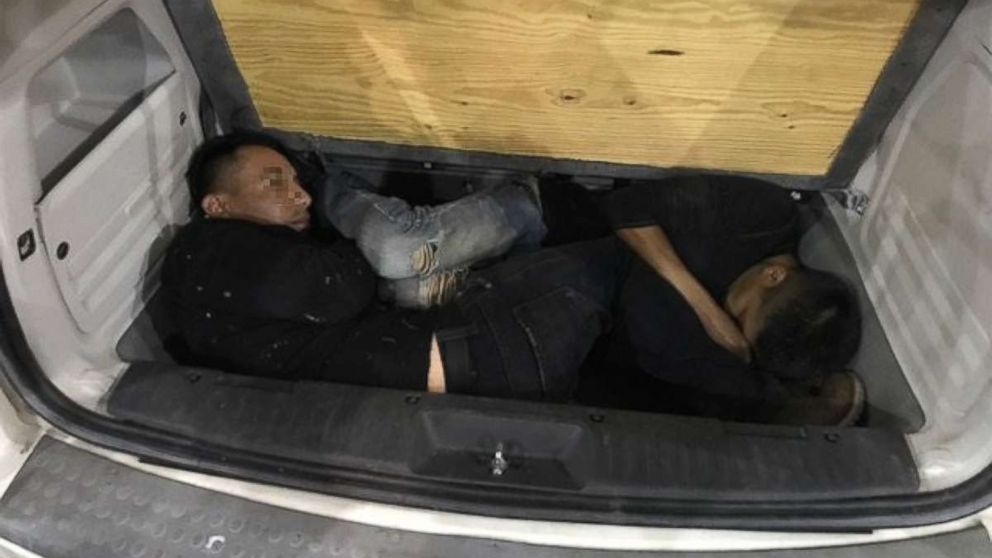 U.S. Customs and Border Protection released this photo of Mexican nationals attempting to be smuggled into the U.S. by hiding in under a van's floorbaord on Sept. 8, 2017, in Arizona.