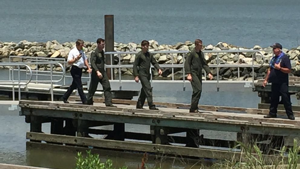 Three people have been rescued after a Navy helicopter crashed into the James River, June 14, 2016.