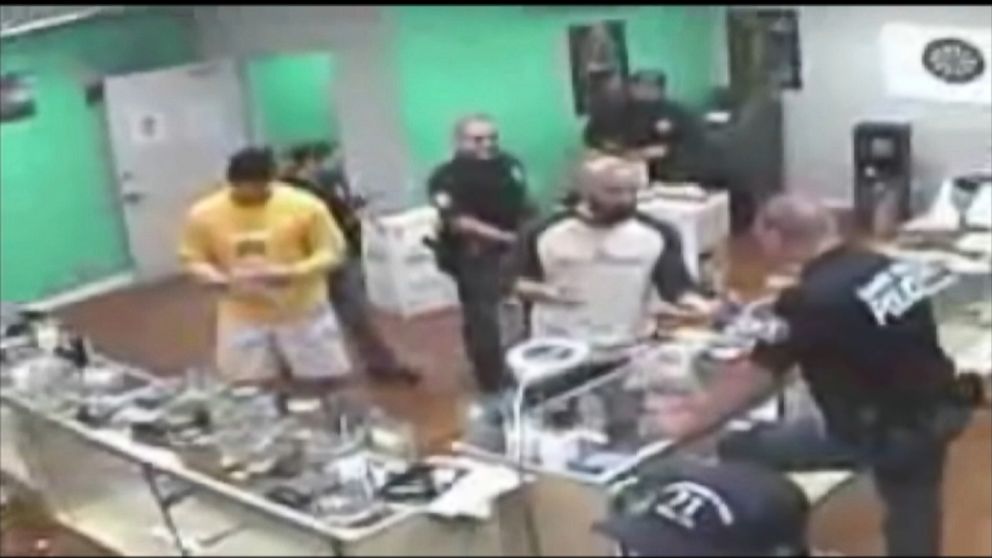 PHOTO: Surveillance video shows a raid conducted by Santa Ana police officers at an unlicensed marijuana dispensary.