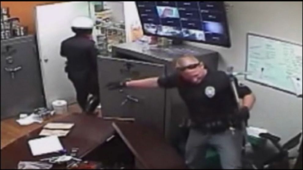 PHOTO: Surveillance video shows a raid conducted by Santa Ana police officers at an unlicensed marijuana dispensary.