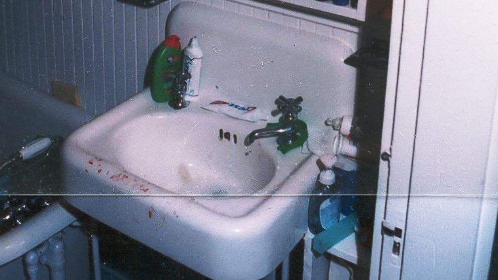 Crime scene photo showing a sink with bloody fingerprints inside Christa Worthington's home. 