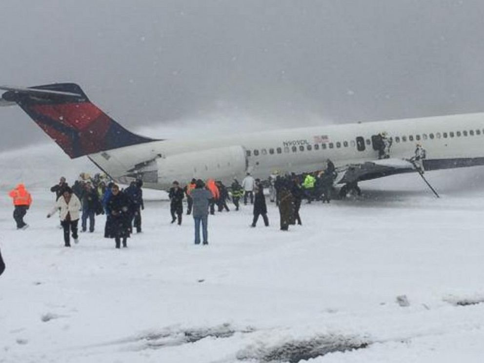 PHOTO: A photo posted to Twitter shows passengers disembarking from a Delta plane the slid off the runway at Laguardia Airport in New York, March 5, 2015. 