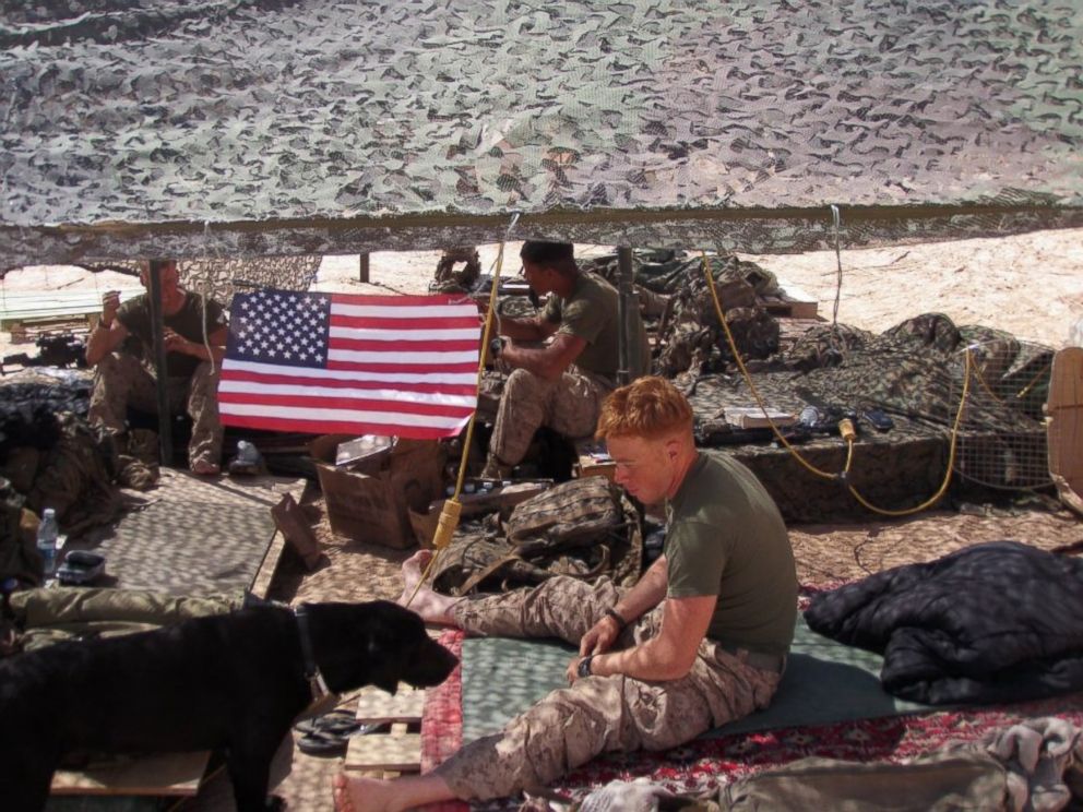 PHOTO: Marine Sgt. Mark Slocum and his dog Tug are pictured here in Afghanistan during Slocum's deployment in 2011.