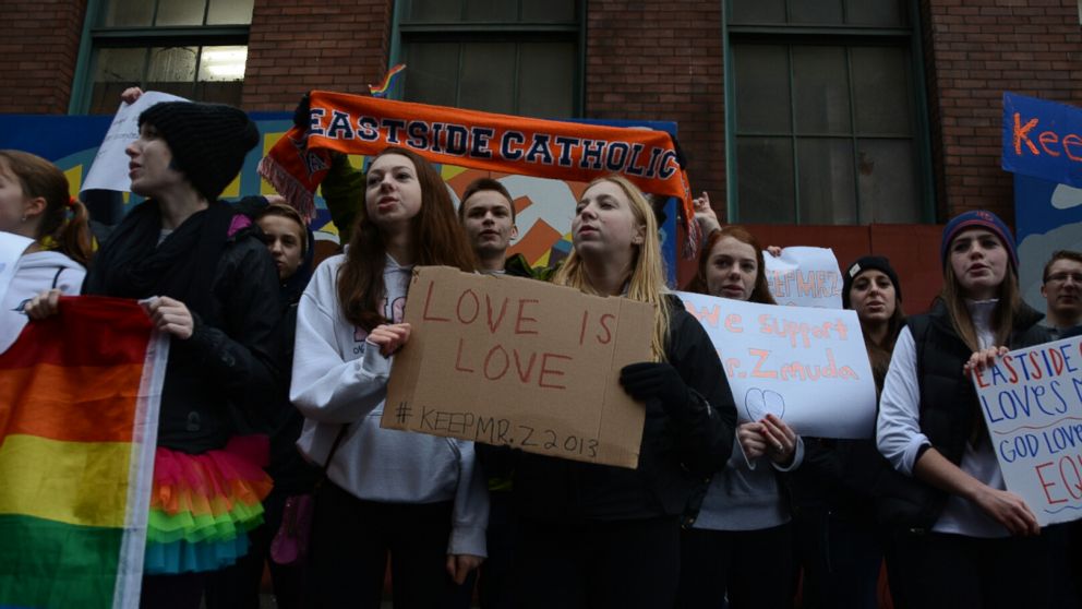 PHOTO: Alumni and students from Seattle's Eastside Catholic School protest Sunday, Dec. 22, 2013, to demand the reinstatement of former vice principal Mark Zmuda.
