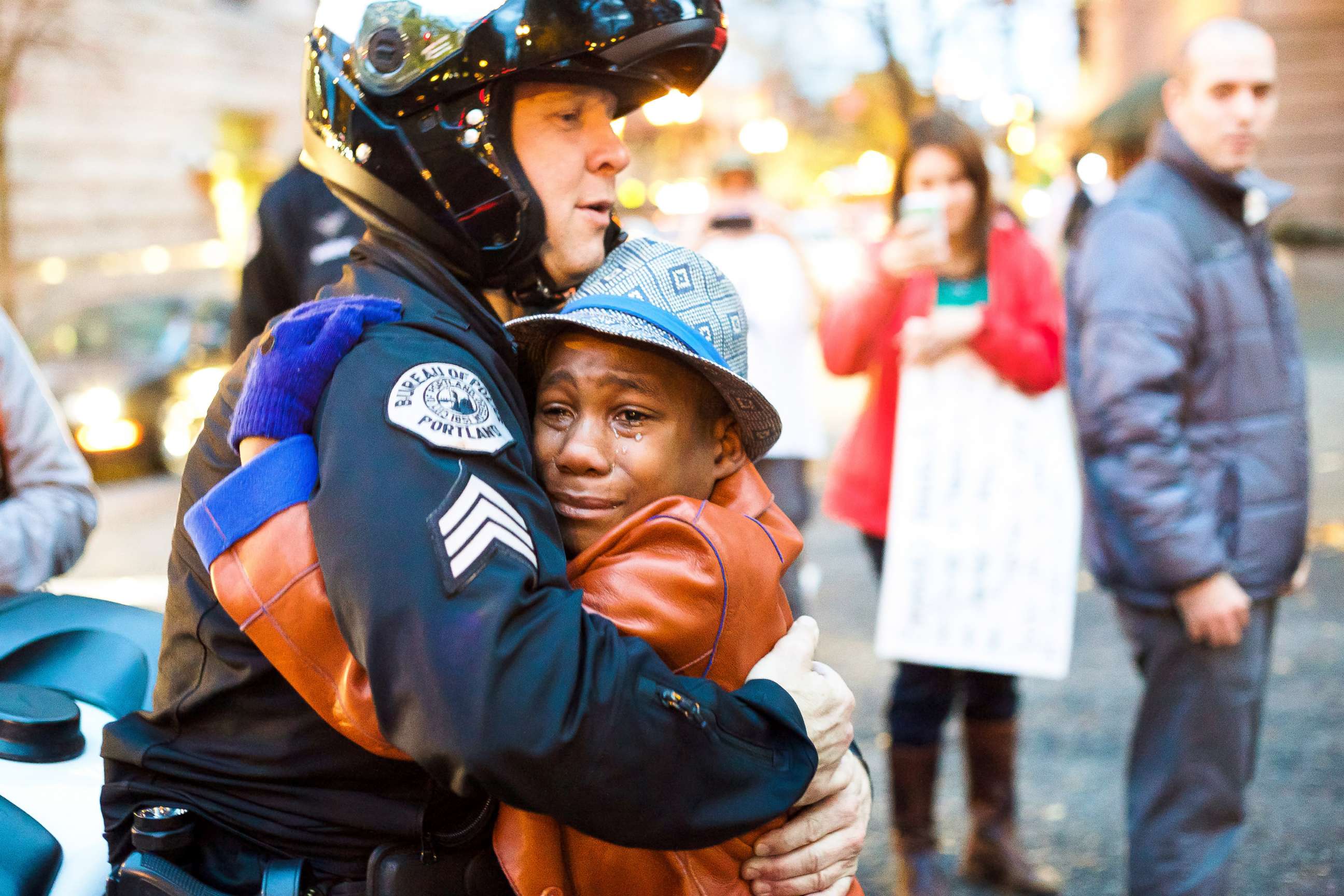 PHOTO: Devonte Hart hugs a cop in Portland, Ore., Nov. 25, 2014, in a photo that went viral. Hart has been reported missing following the death of his parents in a car crash.