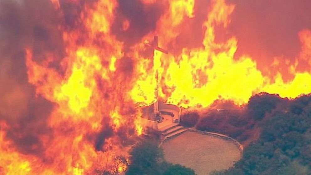 PHOTO: A cross burns in the Blue Cut Fire in the San Bernardino National Forest above Devore on Tuesday, Aug. 16, 2016.