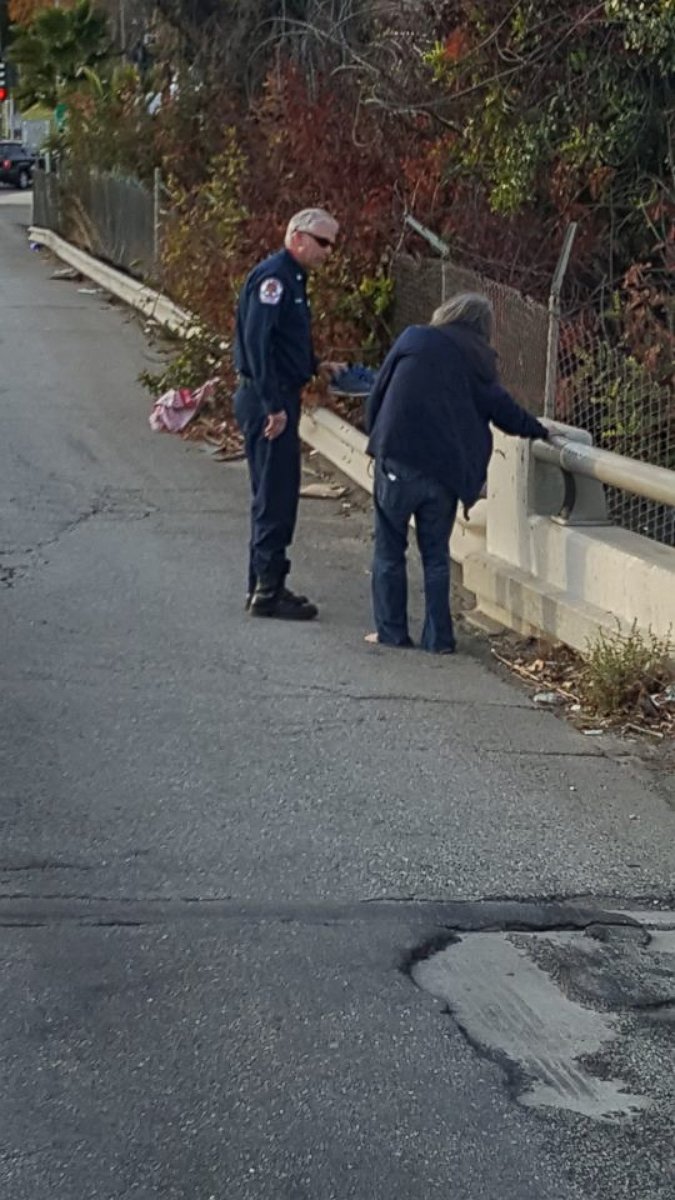 PHOTO: Firefighters in Riverside, Calif., were photographed stopping to give shoes to a barefoot homeless man.