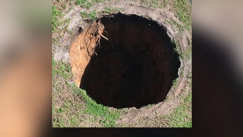 PHOTO: The sinkhole that killed Jeffrey Bush in 2013 re-opened on Aug. 19, 2015 in Seffner, Fla.
