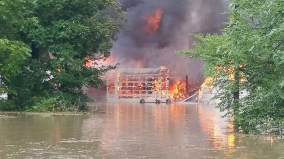 PHOTO: A flooded home caught on fire in Hartford City, Ind.	