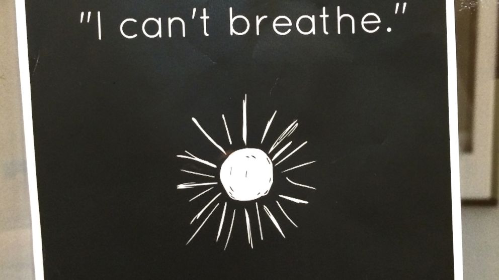 PHOTO: A piece of a paper posted on a professor's portrait in the halls of Harvard Law School, Cambridge, Mass., that reads "I can't breathe." 