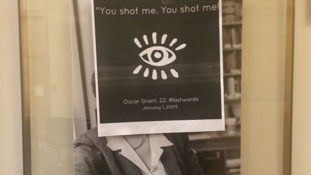 PHOTO: A piece of a paper posted on a professor's portrait in the halls of Harvard Law School, Cambridge, Mass., that reads "You shot me. You shot." 