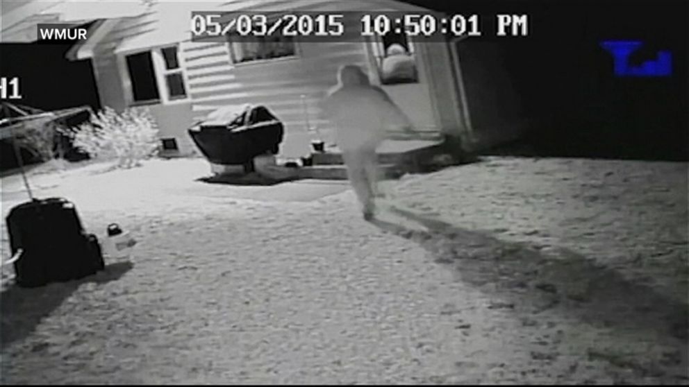 PHOTO: Surveillance video shows two men rush a woman as she opened the dog to let her dog in.
