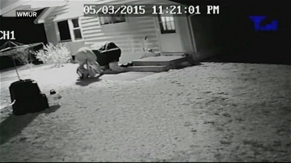 PHOTO: Surveillance video shows two men rush a woman as she opened the dog to let her dog in.
