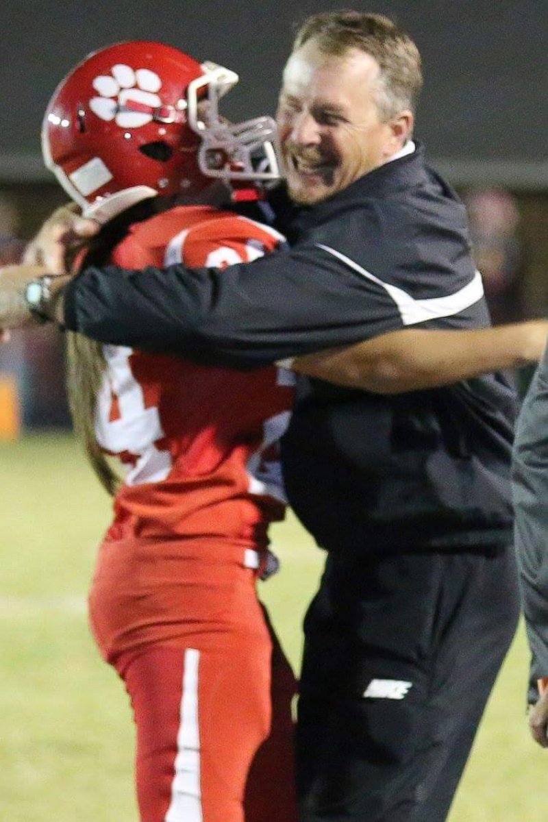 PHOTO: Jodie Farnetti, 17, hugs her father, Gregory Farnetti after scoring a field goal during West Blockton High School's homecoming on Oct. 16, 2015. 