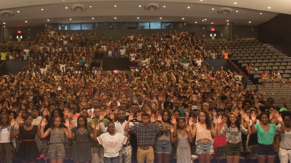 Howard University students posed for a photo with their hands up in surrender pose in honor of Missouri teen Michael Brown, who was shot by a police officer Saturday while holding his hands up, according to witnesses.