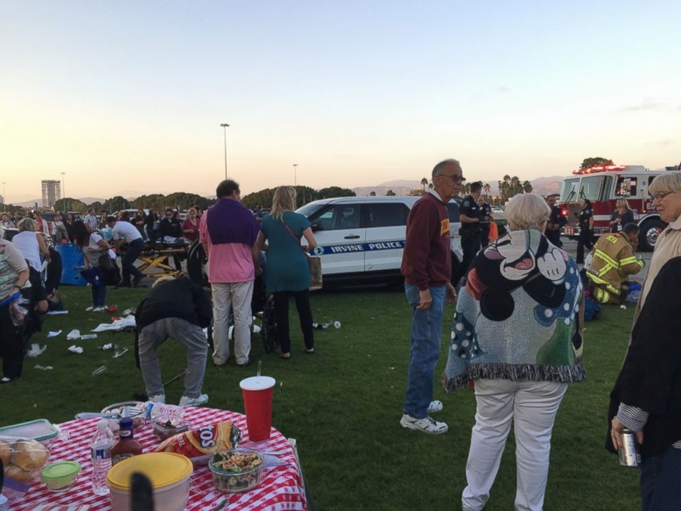 PHOTO: EMS personnel tend to concert-goers at the Irvine Meadows Amphitheatre in Irvine, California, on Sept. 8, 2016. A man in a vehicle caused a chain-reaction crash.