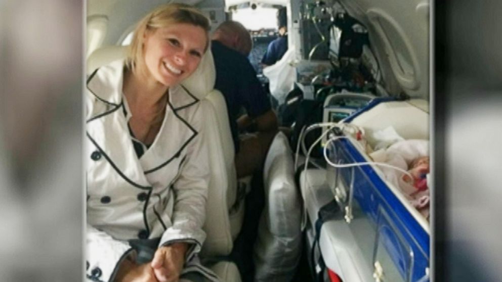PHOTO: Kim Spratt is pictured during the flight home with her family, months after the premature birth of her daughter in Portugal.
