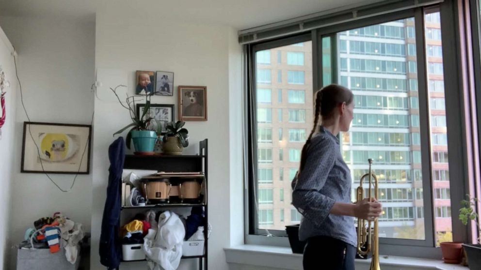 PHOTO: As a trumpet player, Dr. Erin Kulick started playing “Taps” following the daily 7 p.m. cheers for essential workers in New York City.