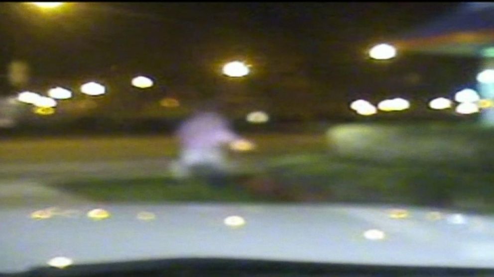 PHOTO: Laquan McDonald runs away from Jason Van Dyke's squad car in this newly released dash cam footage from the Chicago Police Department.