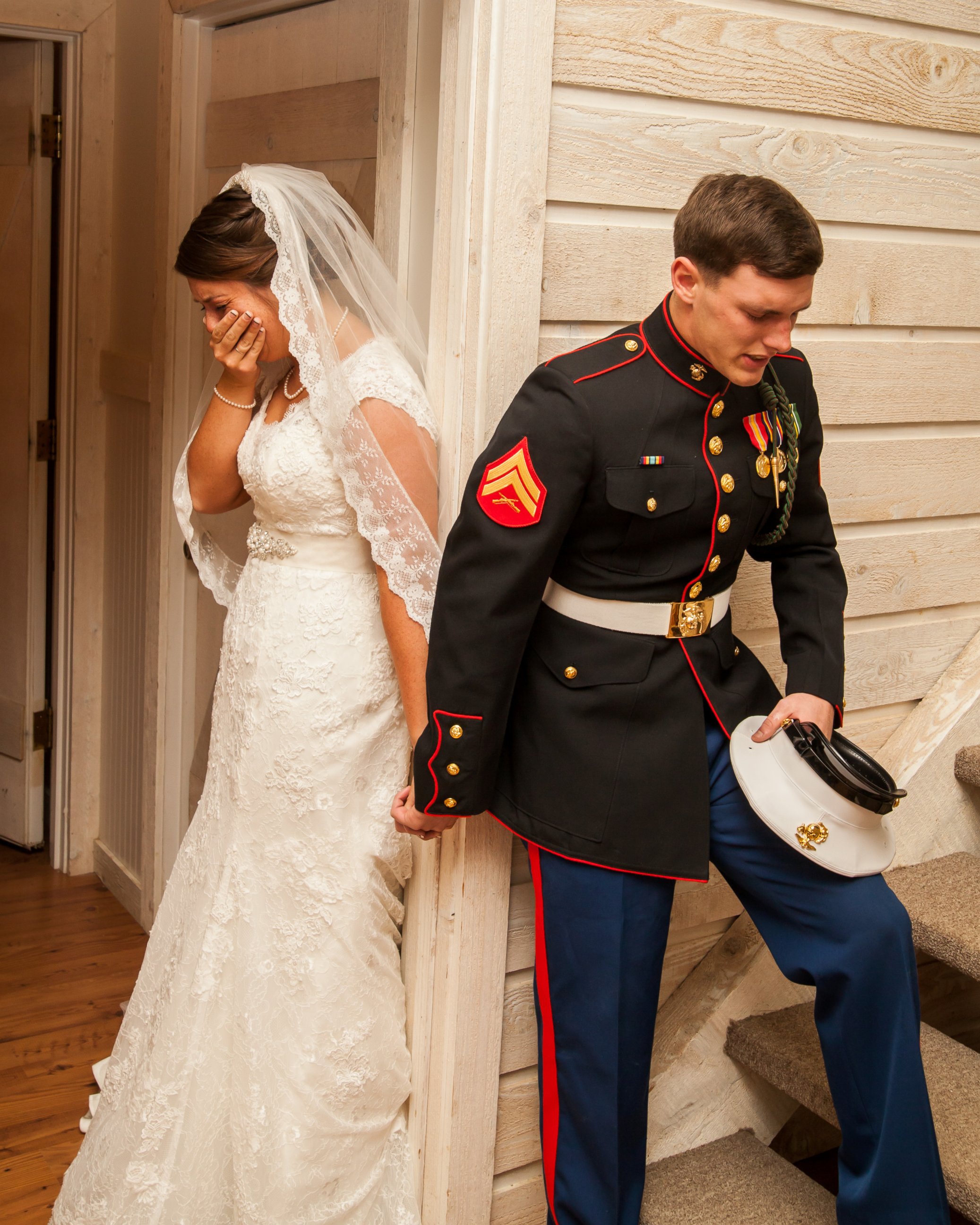 PHOTO: U.S. Marine Cpl. Caleb Earwood prays with his bride-to-be Maggie before their wedding service on Saturday in Asheville, North Carolina.