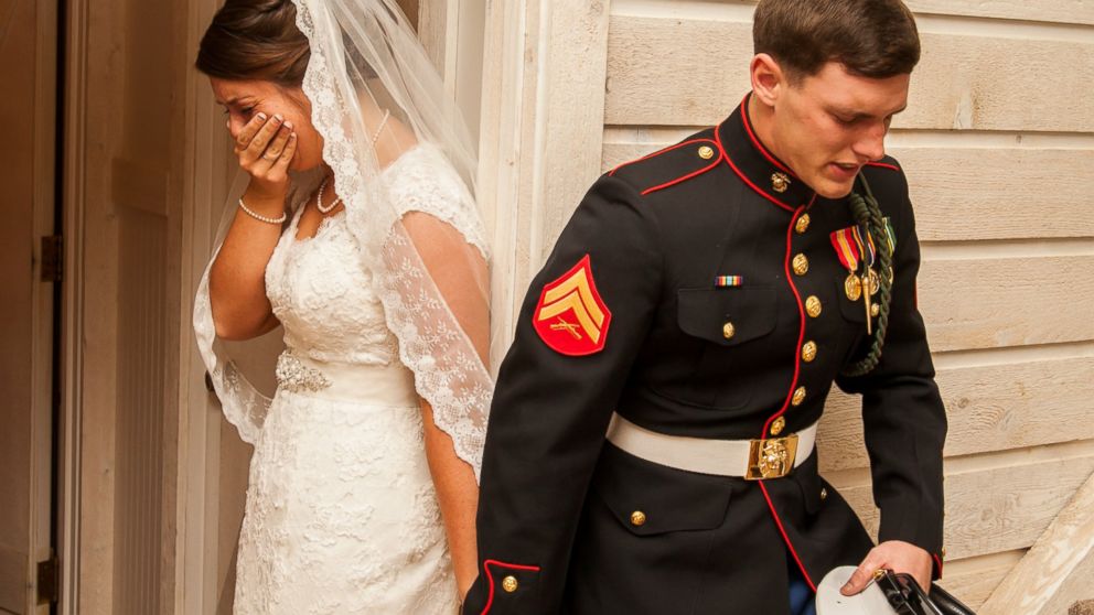 PHOTO: U.S. Marine Cpl. Caleb Earwood prays with his bride-to-be Maggie before their wedding service on Saturday in Asheville, North Carolina.