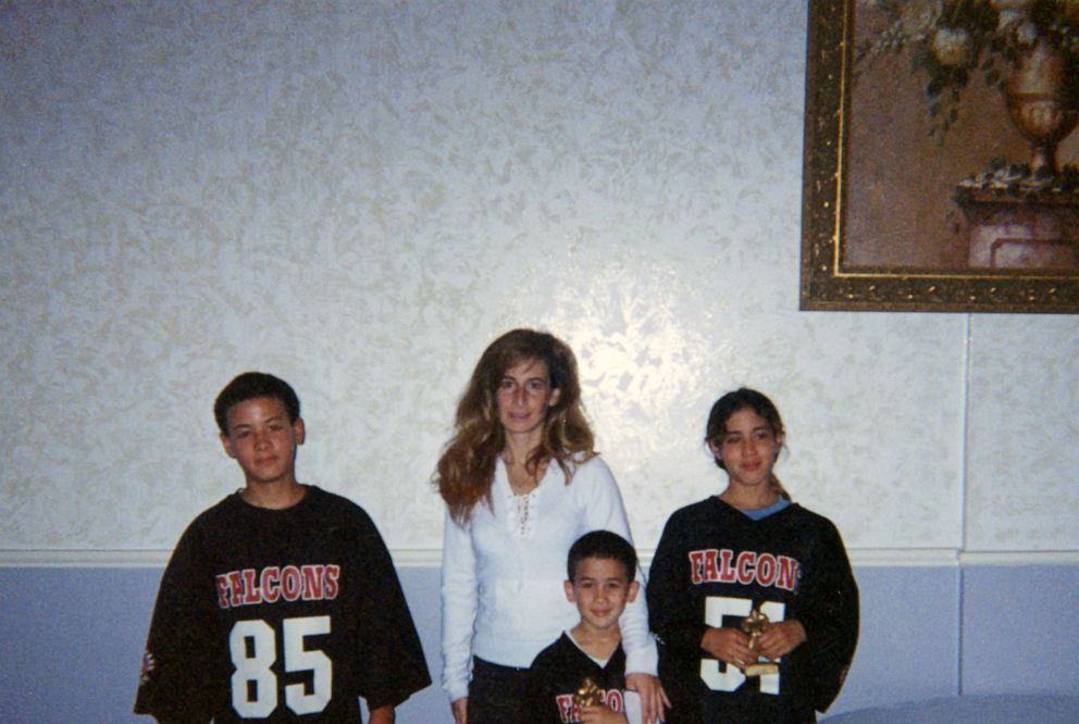 Marni Yang is seen here with her three children in this family photo.