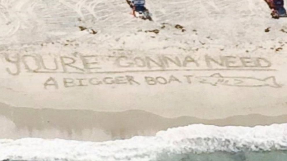 PHOTO: Beach goers left a fitting message after a shark was spotted off the coast of Duxbury Beach, Mass. on Aug. 25, 2014: "You're gonna need a bigger boat," a quote from the movie "Jaws."
