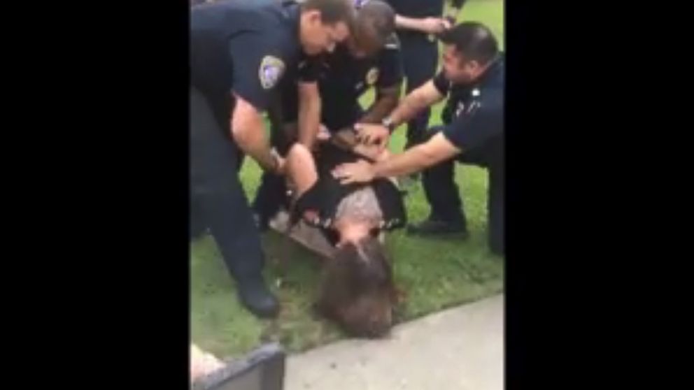 PHOTO: In an image made from video released on April 18, 2015, former U.S. Air Force Staff Sgt. Michelle Manhart is detained by police officers on the campus of Valdosta State University in Valdosta, Ga.