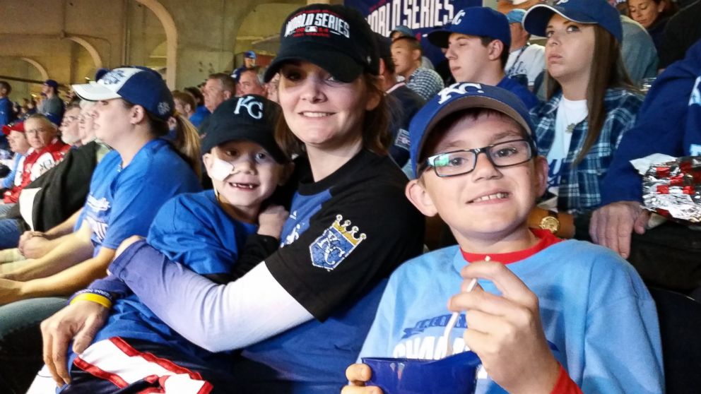 PHOTO: Noah Wilson poses for a photo at the World Series on Oct 21, 2014 with his mom and brother. 