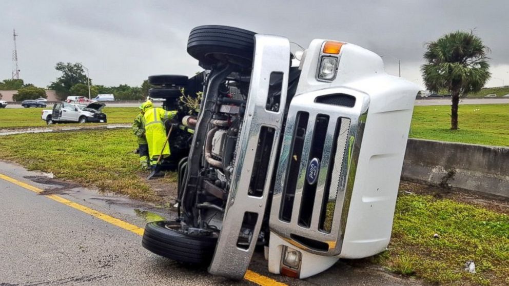 PHOTO: A tractor trailer is pictured after it was overturned by strong winds on Jan. 27, 2016, on the Florida Turnpike near the Coconut Creek Parkway in Broward County, Fla.