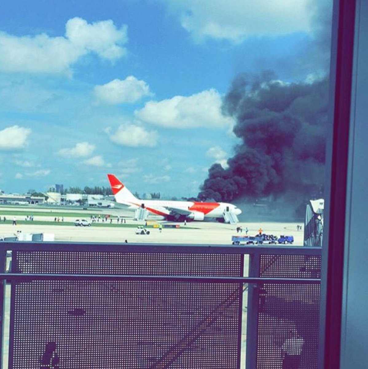 PHOTO: A Dynamic International Airways plane burns on the tarmac at Ft. Lauderdale-Hollywood International Airport on Oct. 29, 2015.