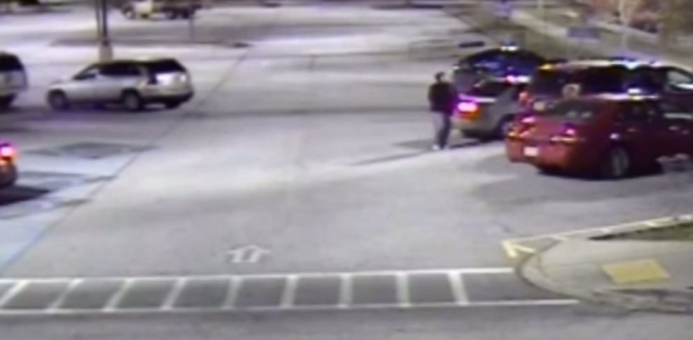 PHOTO: Surveillance footage shows a suspect, later identified by police as Brandon Shawn Smith, approaching Marsha Johnson as she loaded items into her car at a Walmart parking lot in Covington, Georgia on Nov. 16, 2015.