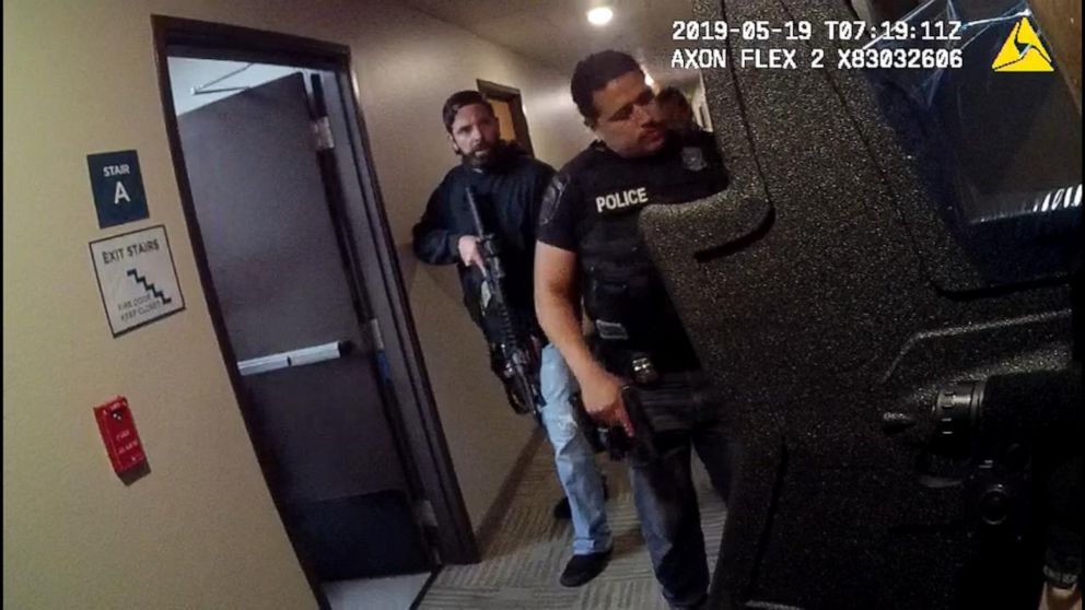 PHOTO: Bodycam footage shows officers surrounding a hotel room at the Woodspring Suites in Forest Hill, Texas, in May.