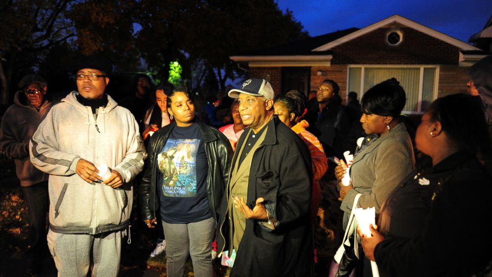 PHOTO: Pastor W. J. Rideout of Detroit Good Jobs Now, Bernita Spinks and Ron Scott of Detroit Coalition Against Police Brutality at the vigil for Renisha McBride in the front of the home of the shooting in Dearborn Heights on Nov. 6, 2013.   