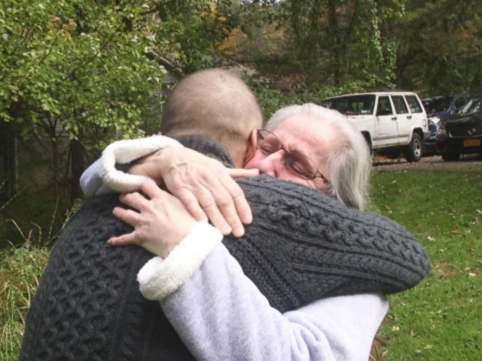 Deborah Garza and Rob Martin embrace after meeting for the first time.