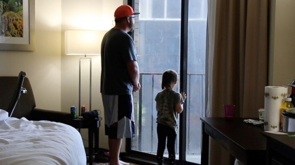 PHOTO: William Weeks and his daughter Anabella at a hotel in Corpus Christi, Texas, on August 25, 2017, after they were forced to evacuate their home due to the arrival of Hurricane Harvey.